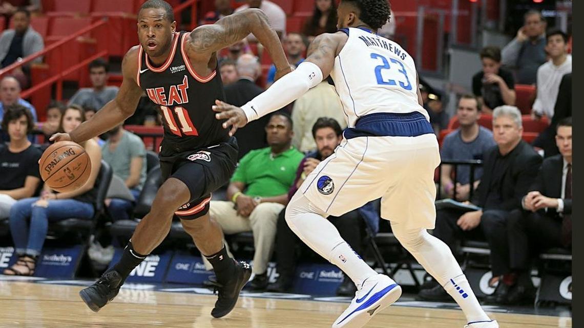 Heat guard Dion Waiters drives to the basket against Mavericks guard Wesley Matthews on Friday before leaving with a sprained left ankle.