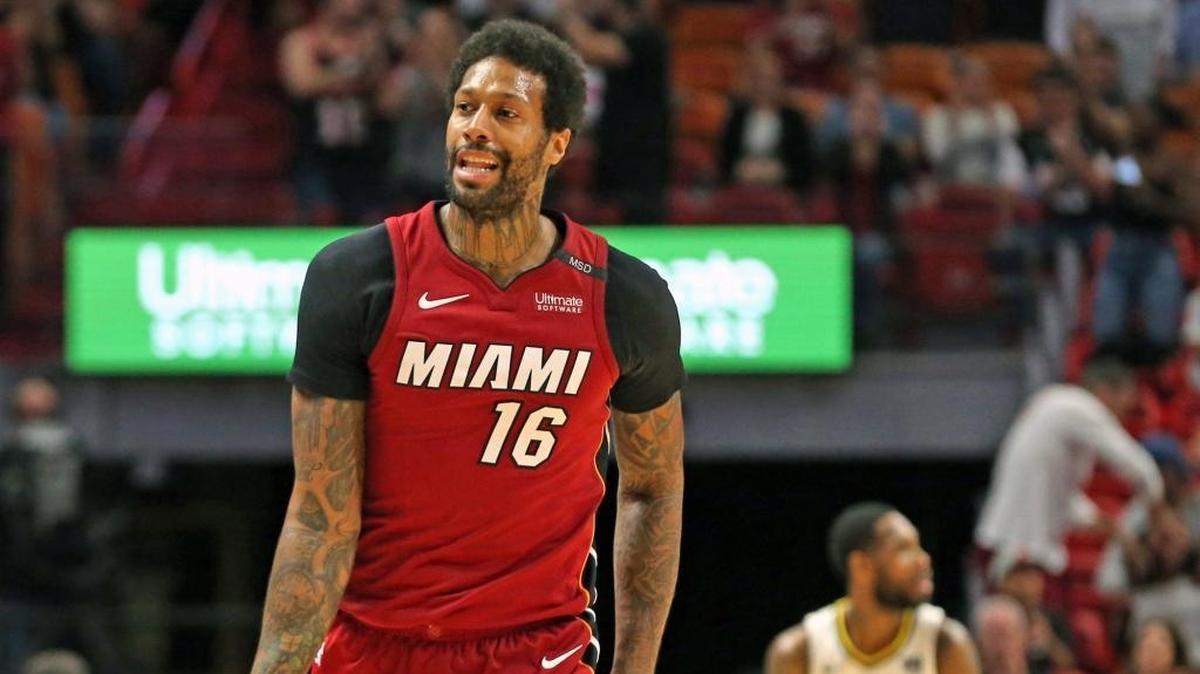 Miami Heat forward James Johnson signals a three-pointer against Denver on Monday. Johnson is playing perhaps his best basketball of the season.