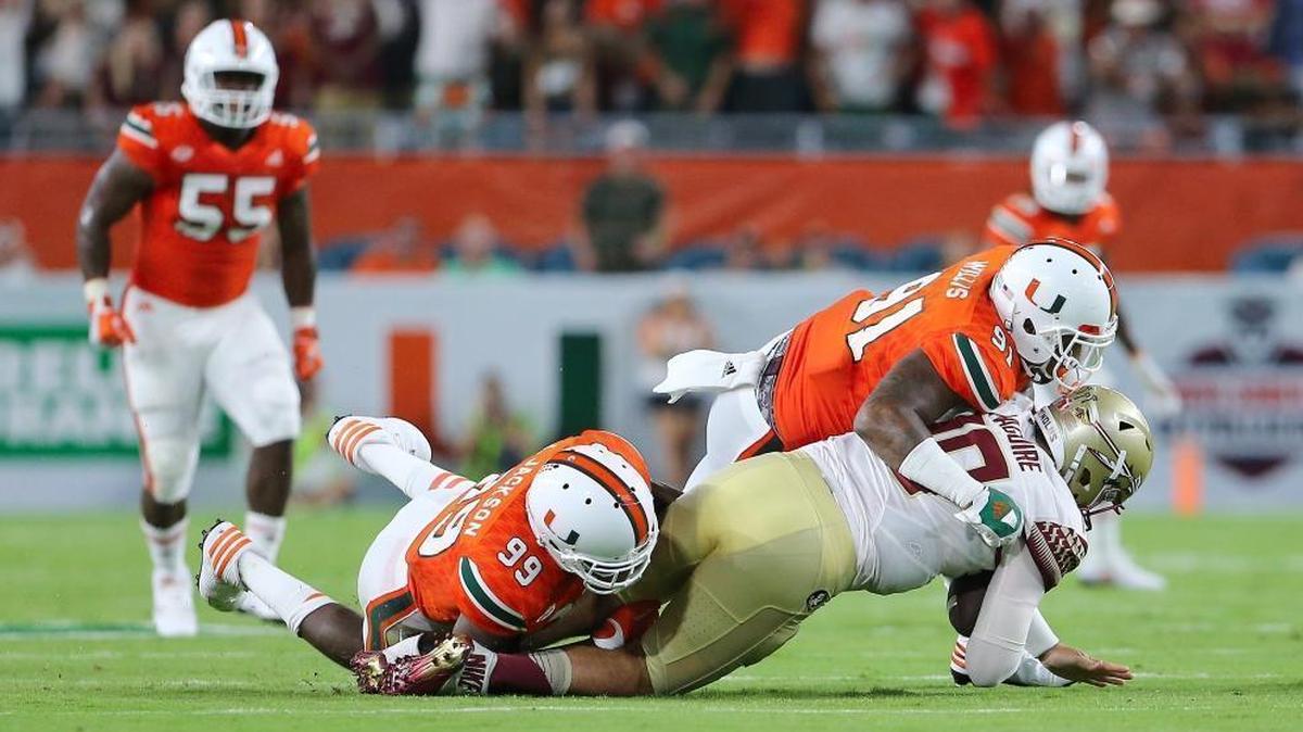 UM defensive linemen Gerald Willis (91) and Joe Jackson (99) — seen here sacking FSU quarterback Sean Maguire in a 2016 game — will be key pieces next season on a Hurricanes line that loses several key contributors.