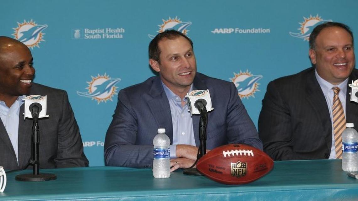 Miami Dolphins General Manager Chris Grier, Head Coach Adam Gase and Executive Vice President of Football Operations Mike Tannenbaum, talk with the media about their first round draft pick Laremy Tunsil, at the Miami Dolphins training facility in Davie, Florida, April 29, 2016.