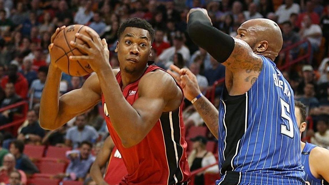 Miami Heat center Hassan Whiteside goes to the basket against Magic's forward Marreese Speights, in the second quarter of the their game on Dec. 26.