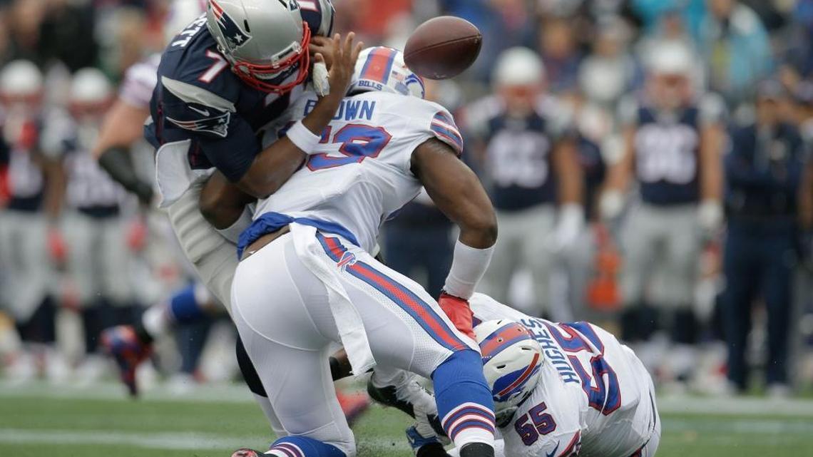 Buffalo Bills linebacker Zach Brown (53) forces a fumble by New England Patriots quarterback Jacoby Brissett (7) during the first half of an NFL football game Sun., Oct. 2, 2016, in Foxborough, Mass.