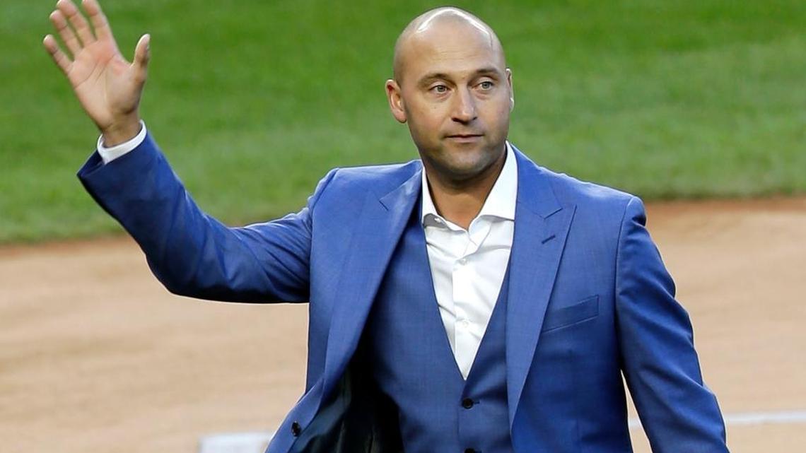 In this May 14, 2017, file photo, former New York Yankees player Derek Jeter waves to fans during a ceremony retiring his number at Yankee Stadium in New York. A person familiar with the negotiations says the Miami Marlins have told Major League Baseball they intend to sign an agreement to sell the team to a group that includes Jeter. The person confirmed the Marlins' plans to The Associated Press on condition of anonymity Friday, Aug. 11, 2017, because the team had not commented publicly. (AP Photo/Seth Wenig, File)