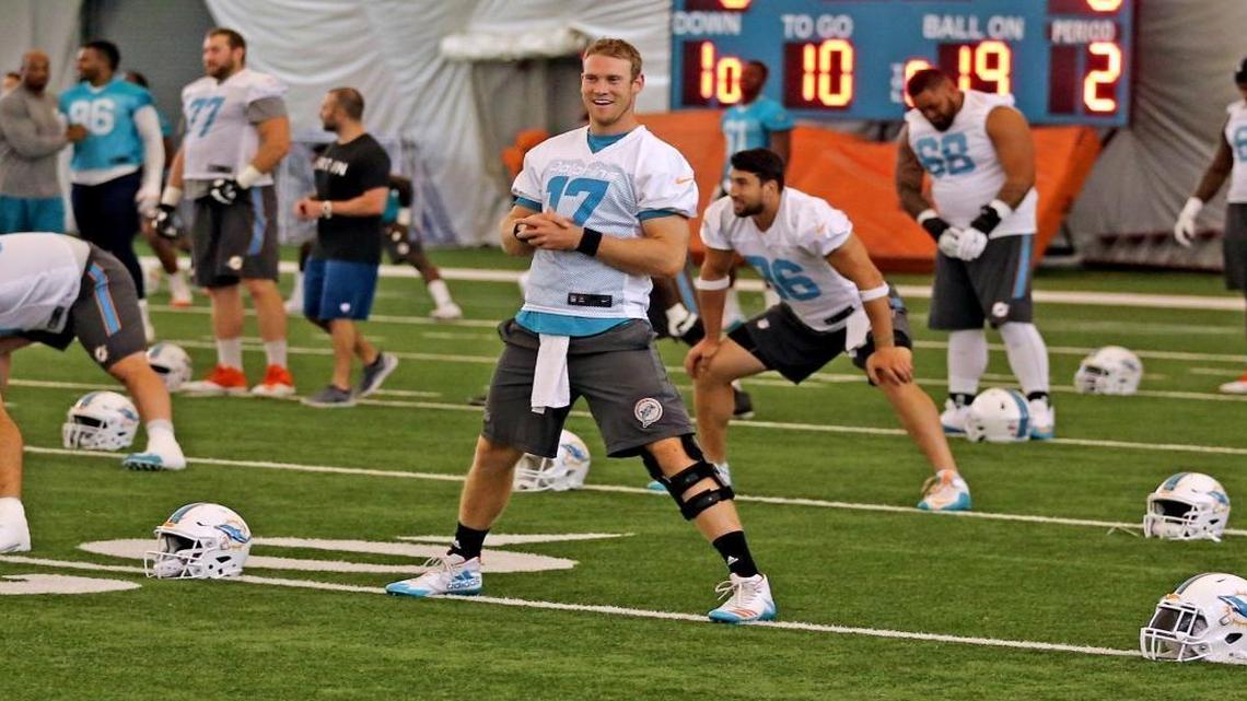 Miami Dolphins quarterback Ryan Tannehill smiles during OTAs practice at the Miami Dolphins training facility in Davie, Florida, May 25, 2017.