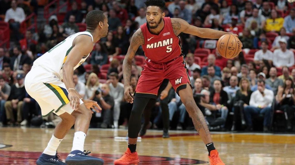 Utah Jazz guard Alec Burks (10) defends against Miami Heat forward Derrick Jones Jr. (5) during a Jan. 7 game. Jones, on a two-way contract, has impressed the Heat.