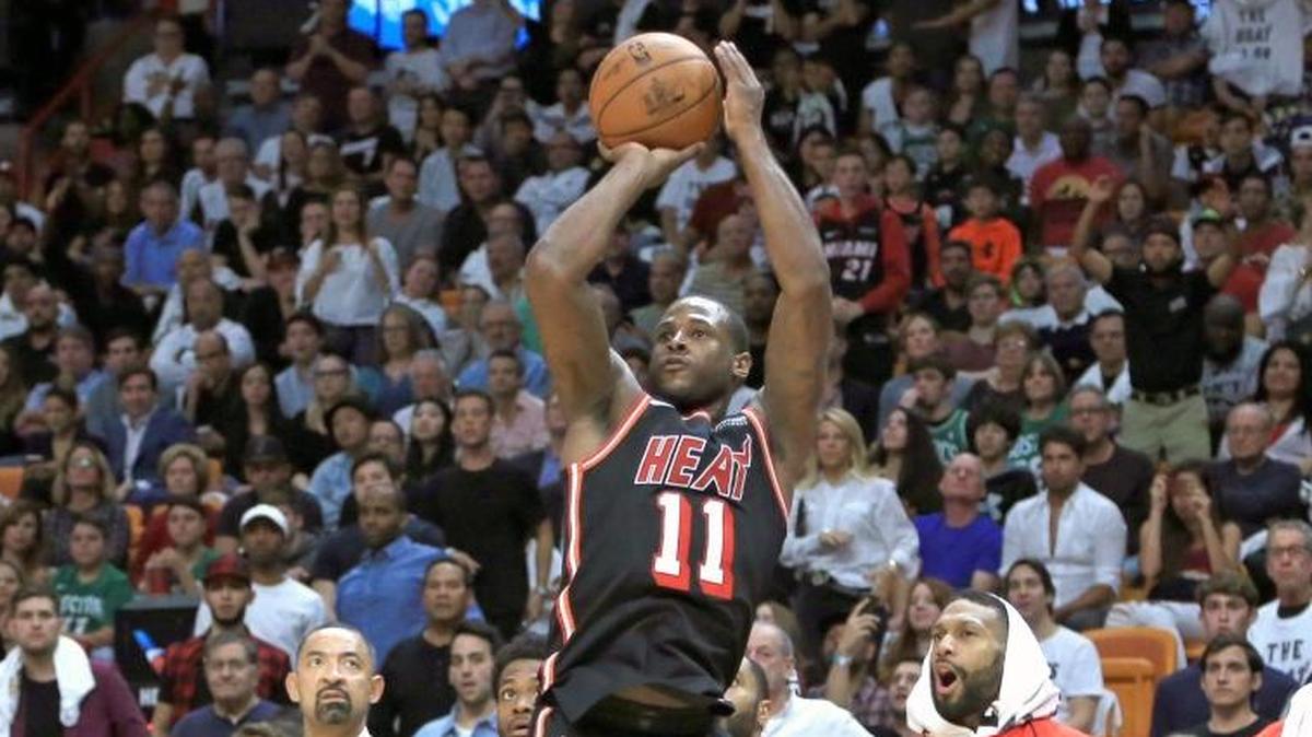 Miami Heat guard Dion Waiters (11) hits a three pointer in the fourth quarter as the Miami Heat host the Boston Celtics at the AmericanAirlines Arena on Wed., Nov. 22, 2017.