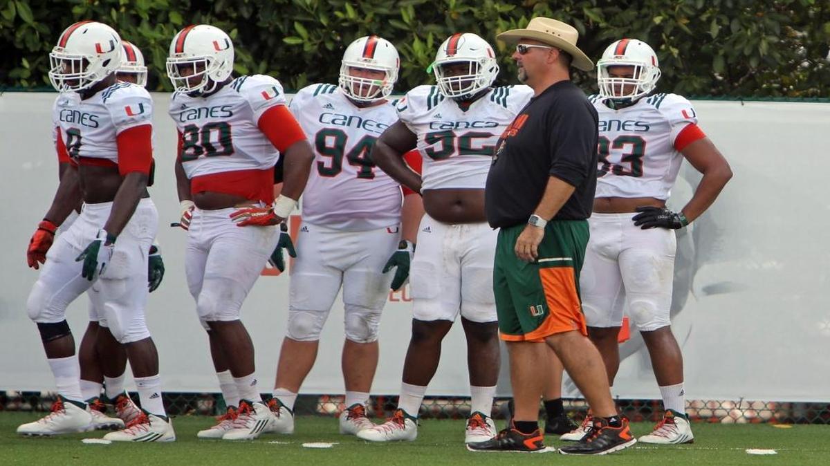 University of Miami defensive line football coach, Craig Kuligowski works with the team during practice, Monday morning, Aug. 15 , 2016.