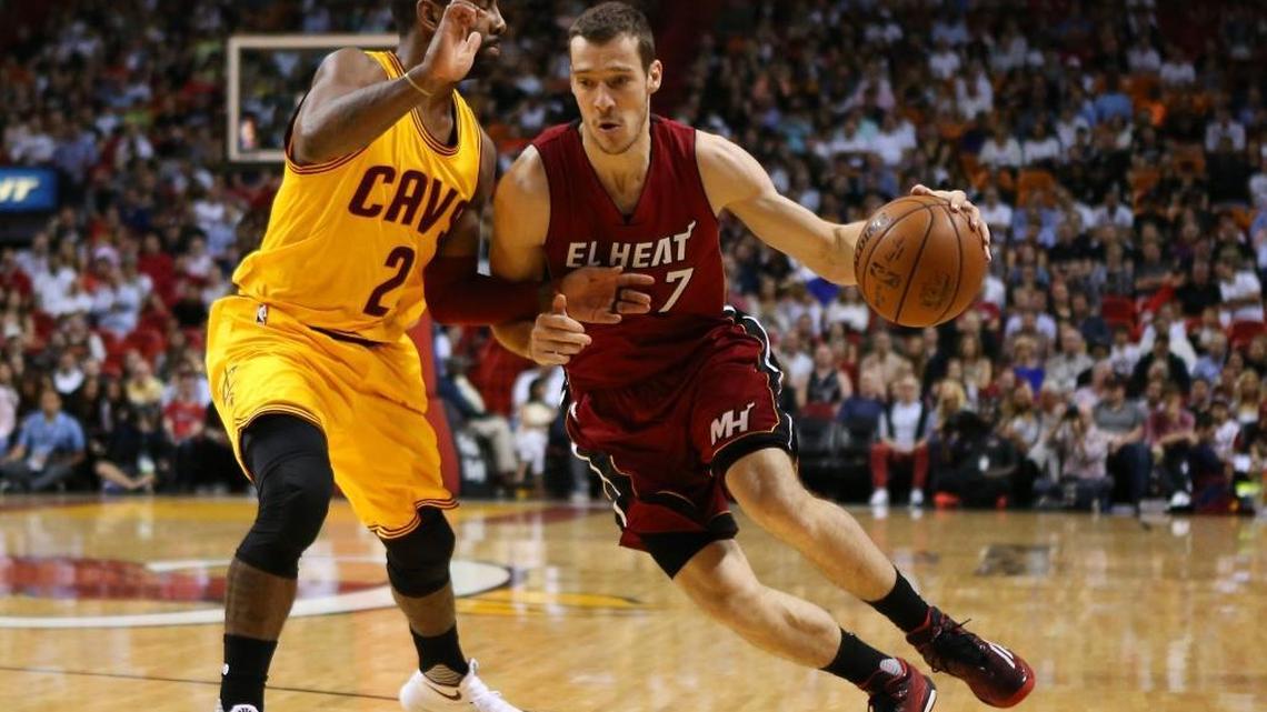 Goran Dragic, guard of the Miami Heat drives against Kyrie Irving, guard of the Cleveland Cavaliers during the first quarter of an NBA basketball game at the AmericanAirlines Arena in Miami on Saturday, March 19, 2016.