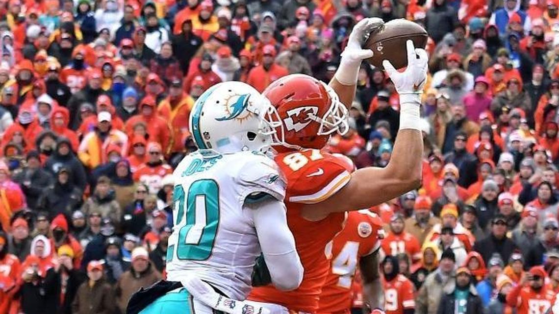 Kansas City Chiefs tight end Travis Kelce catches a touchdown pass in front of Dolphins safety Reshad Jones in a Christmas Eve game. The Dolphins were among the NFL’s worst teams defending opposing tight ends in pass coverage.