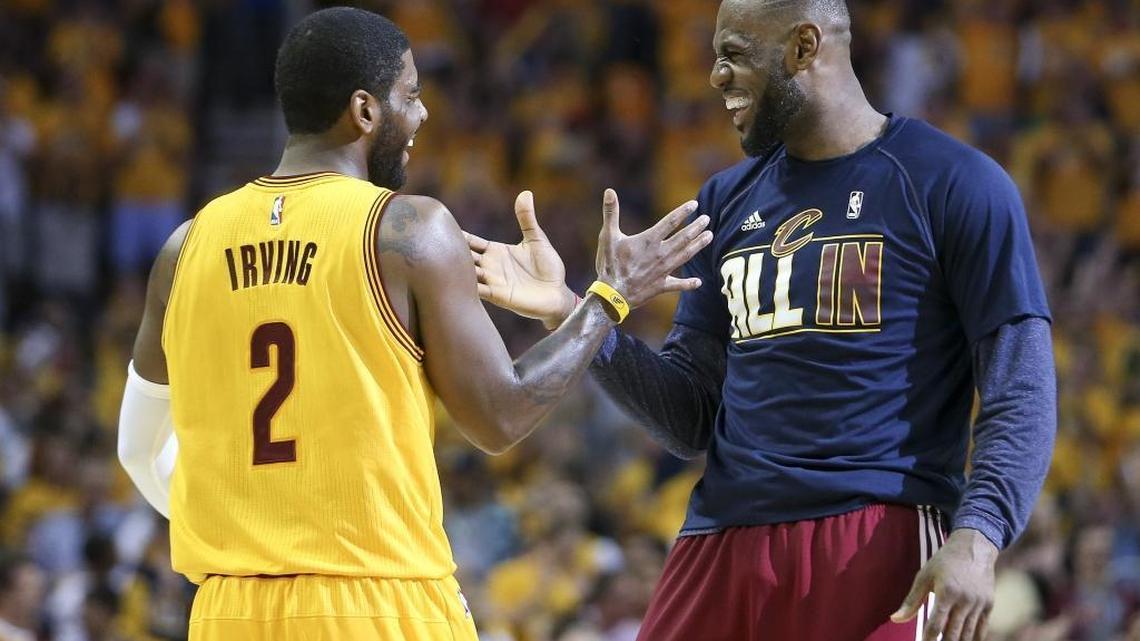 Cleveland’s LeBron James and Kyrie Irving greet each other during a timeout in the 2015 NBA playoffs on May 26, 2015.