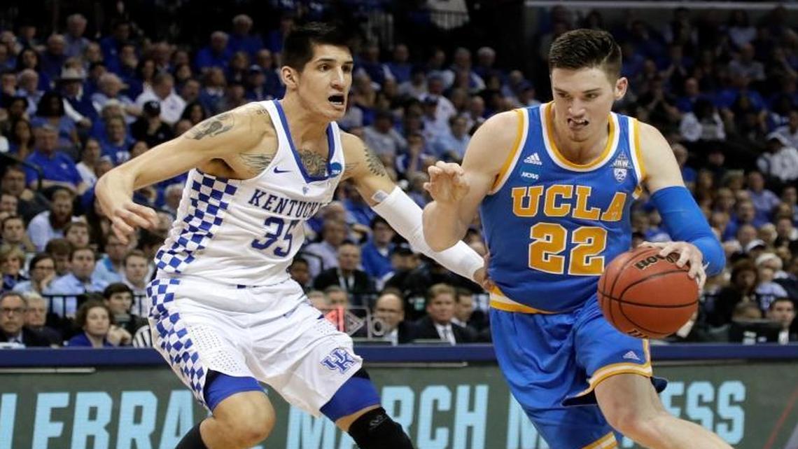 UCLA forward TJ Leaf (22) drives against Kentucky forward Derek Willis (35) in the second half of an NCAA college basketball tournament South Regional semifinal game Friday, March 24, 2017, in Memphis, Tenn.