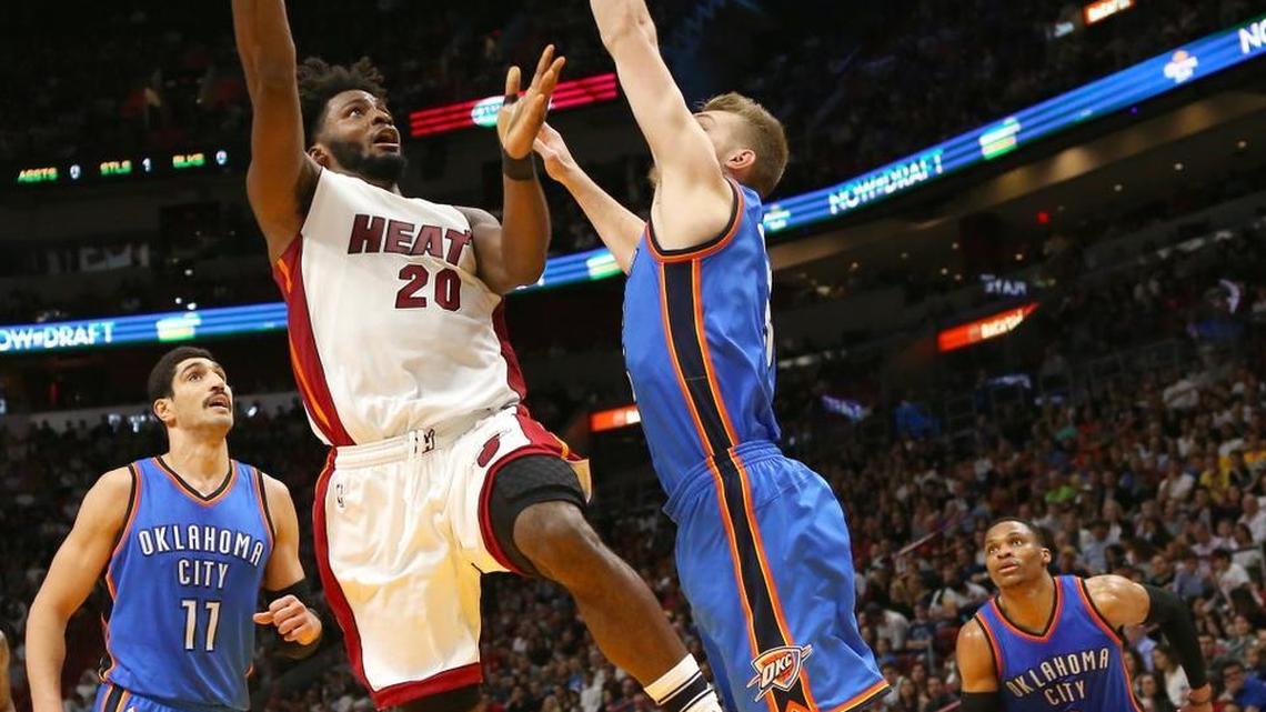 Miami Heat forward Justise Winslow goes to the basket against Oklahoma City Thunder forward Domantas Sabonis during the second quarter of an NBA basketball game at AmericanAirlines Arena in Miami on Tuesday, December 27, 2016.