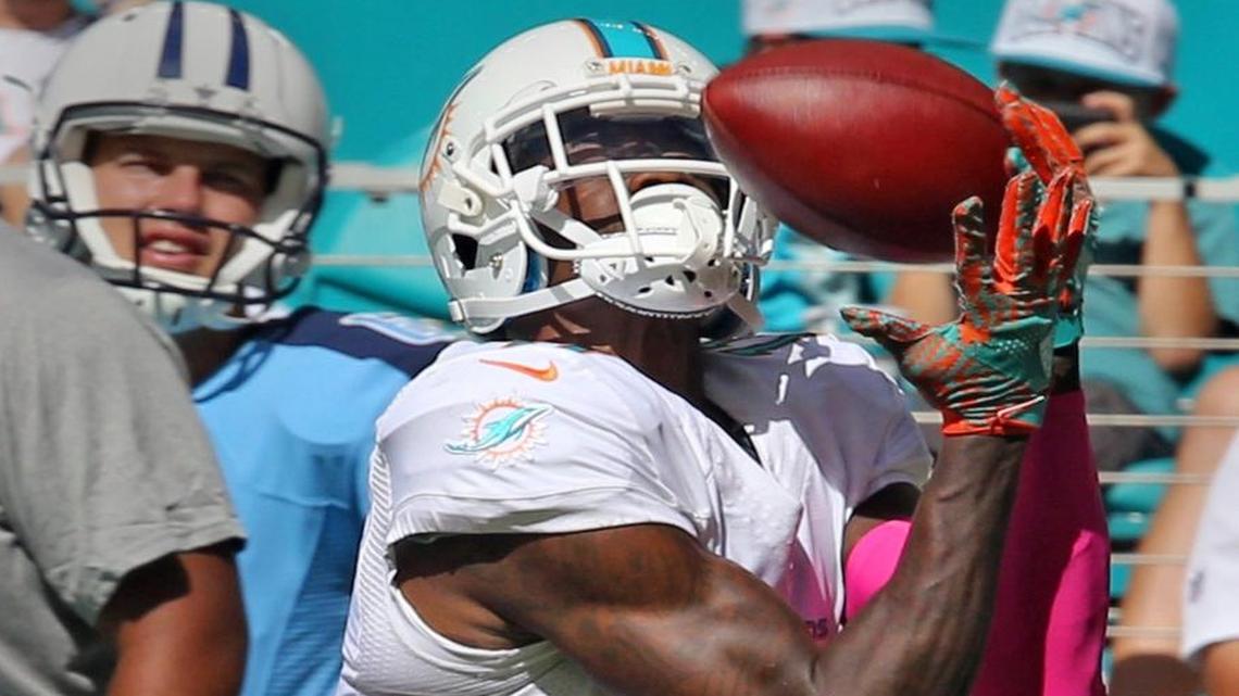 Miami Dolphins DeVante Parker catches a long pass in the third quarter as thye play the Tennessee Titians at the Hard Rock Stadium in Miami Gardens, Florida on Sun., Oct. 9, 2016.