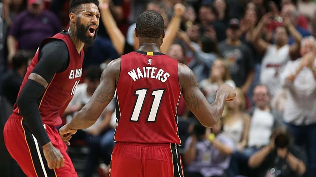 Miami Heat forward James Johnson celebrates Dion Waiters' three pointer over Hornets' Kemba Walker in the fourth quarter of the Miami Heat vs Charlotte Hornets NBA game at AmericanAirlines Arena in Miami on Wednesday, March 8, 2017.