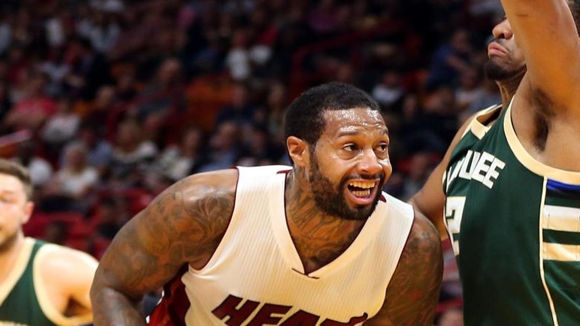 Miami Heat forward James Johnson, drives against Bucks' forward Jabari Parker, in the second quarter of the Miami Heat vs Milwaukee Bucks, NBA game, at AmericanAirlines Arena in Miami on Thurs., Nov. 17, 2016.