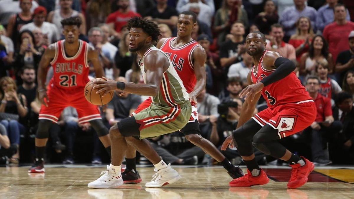 Miami Heat forward Justise Winslow drives against Chicago Bulls guard Dwyane Wade (3) during the fourth quarter of an NBA basketball game at AmericanAirlines Arena in Miami on Thurs., Nov. 10, 2016.