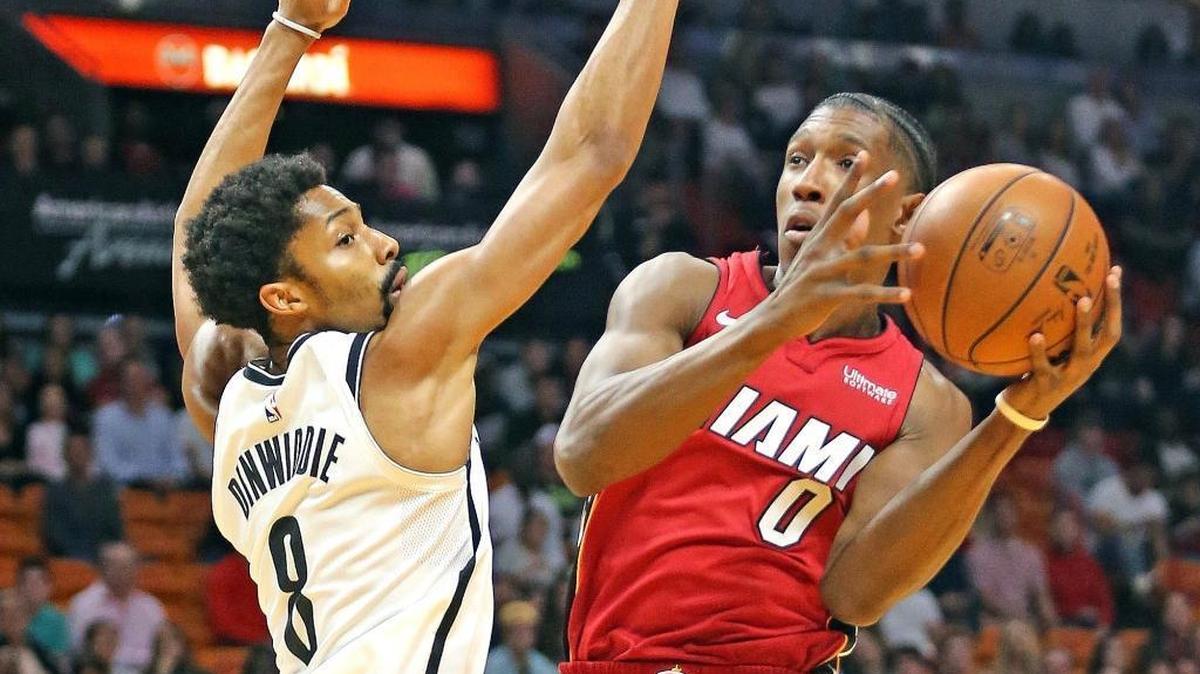 Miami Heat Josh Richardson (0) drives to the basket and scores past Brooklyn Nets Spencer Dinwiddle (8) in the first quarter Friday, Dec. 29, 2017, at the AmericanAirline Arena in Miami.