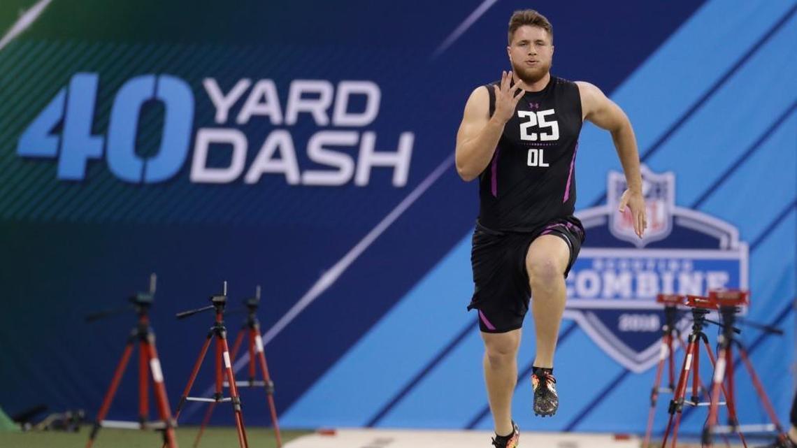 UCLA offensive lineman Kolton Miller runs the 40-yard dash during the NFL Combine last month in Indianapolis. Miller is visiting the Dolphins on Wednesday. (AP Photo/Darron Cummings)