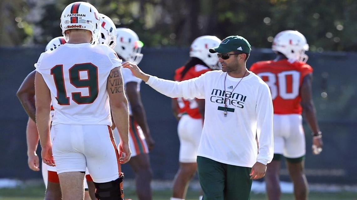 UM defensive coach Manny Diaz talks to players at practice during the second day of University of Miami football camp at Greentree Field on Wednesday, Aug. 2, 2017.