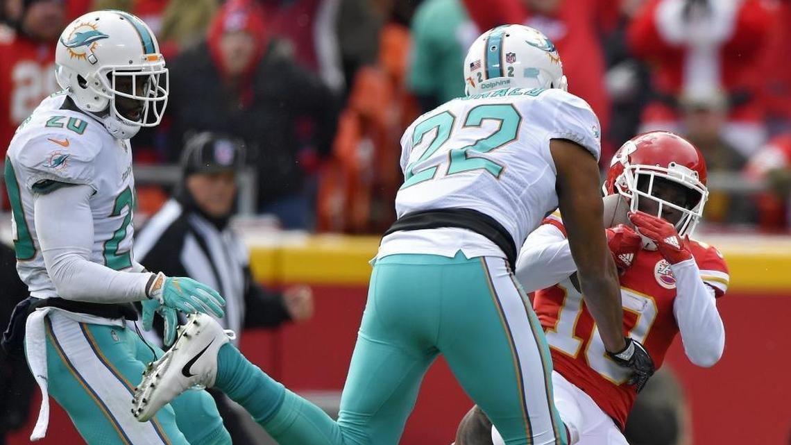 Kansas City Chiefs wide receiver Tyreek Hill catches a 52-yard pass in front of Miami Dolphins strong safety T.J. McDonald in Miami’s loss in December. Adam Gase wants better chemistry between safeties McDonald and Reshad Jones.