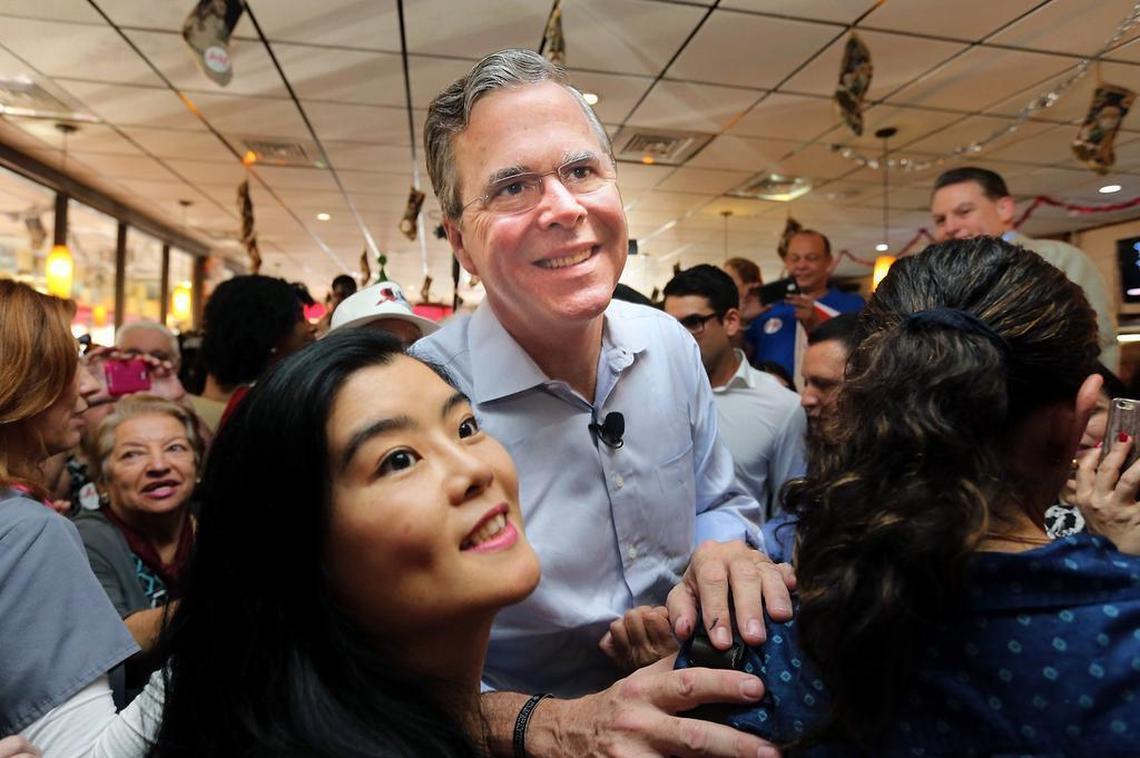Presidential candidate Jeb Bush smiles for selfies with supportets at Chico’s Cuban Restaurant in Hialeah on Monday Dec. 28, 2015 on his first leg of many campaign stops in Florida.