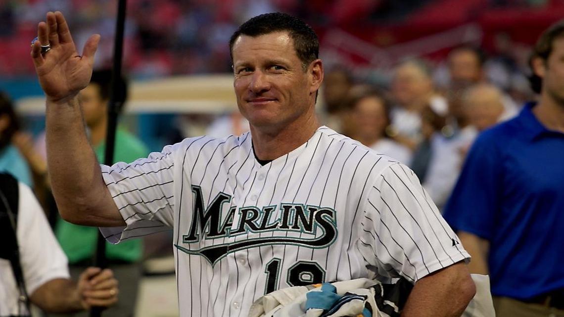 Jeff Conine acknowleges fans as he is carrying the 2 championship flags and was voted to the Marlins all time team after the last Florida Marlins game at Sun Life Stadium against the Washington Nationals in Miami Gardens on September 28,2011.