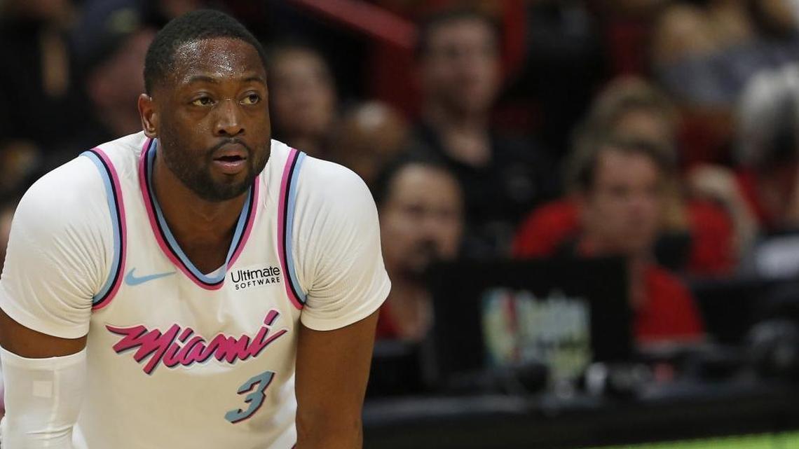 Miami Heat guard Dwyane Wade looks on during Friday’s game against Milwaukee, his first game back in a Heat uniform.