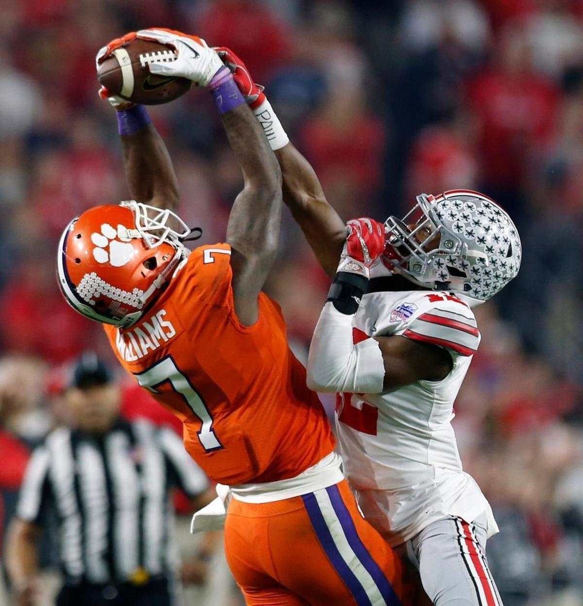 Clemson wide receiver Mike Williams (7) makes a catch against Ohio State cornerback Denzel Ward (12) in the 2016 Fiesta Bowl. Ward, a highly rated cornerback, will take a pre-draft visit to the Dolphins.