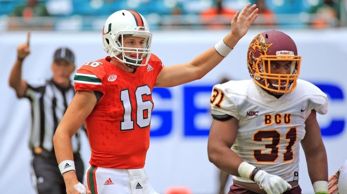 Miami Hurricanes quarterback Evan Shirreffs (16) signals a first down in the fourth quarter as the University of Miami hosts Bethune-Cookman at Hard Rock Stadium on Saturday, Sept. 2, 2017.