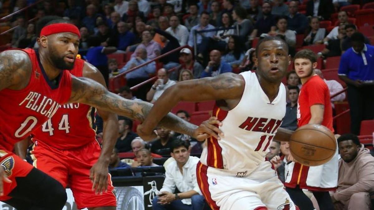 Miami Heat guard Dion Waiters drives against New Orleans Pelicans forward DeMarcus Cousins during the first quarter of an NBA basketball game at AmericanAirlines Arena in Miami on Wed., March 15, 2017.