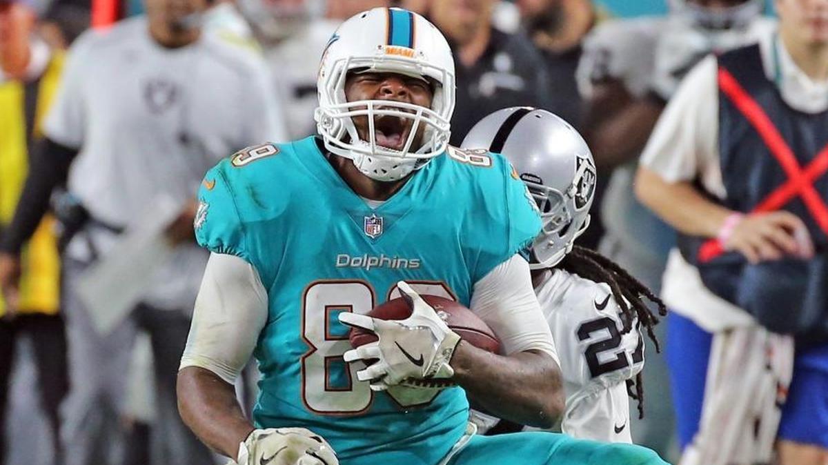 Miami Dolphins tight end Julius Thomas (89) screams after a fourth quarter reception in Sunday’s game against Oakland. Thomas had his best receiving game of the season.