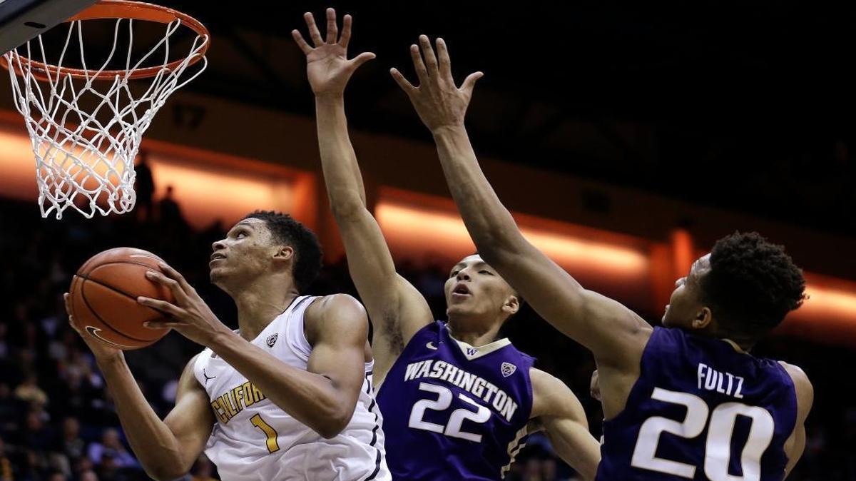 California's Ivan Rabb, left, shoots past Washington's Dominic Green (22) and Markelle Fultz (20) in the second half of an NCAA college basketball game Thurs., Jan. 12, 2017, in Berkeley, Calif.