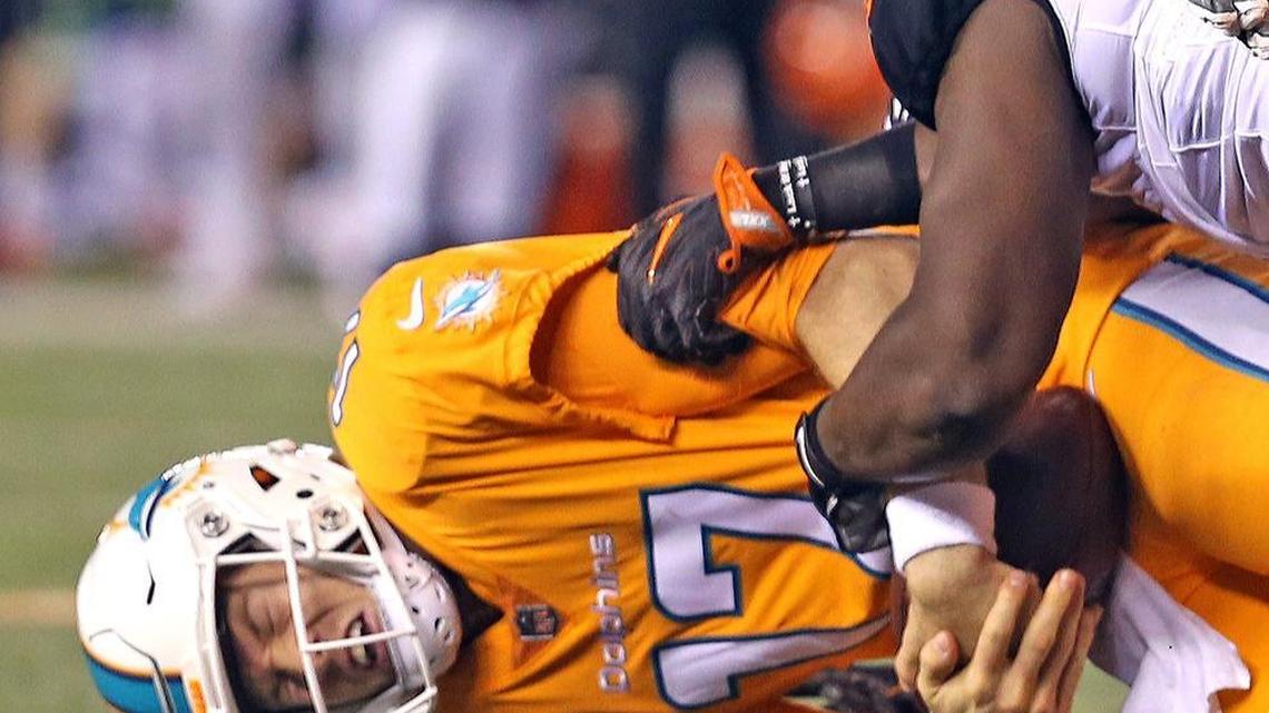 Miami Dolphins quarterback Ryan Tannehill is sacked in the fourth quarter as they are defeated by the Cincinnati Bengals at Paul Brown Stadium in Cincinnati, Ohio on Thurs., Sept. 29, 2016.