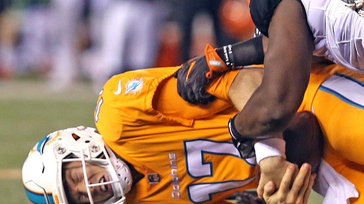 Miami Dolphins quarterback Ryan Tannehill is sacked in the fourth quarter as they are defeated by the Cincinnati Bengals at Paul Brown Stadium in Cincinnati, Ohio on Thurs., Sept. 29, 2016.