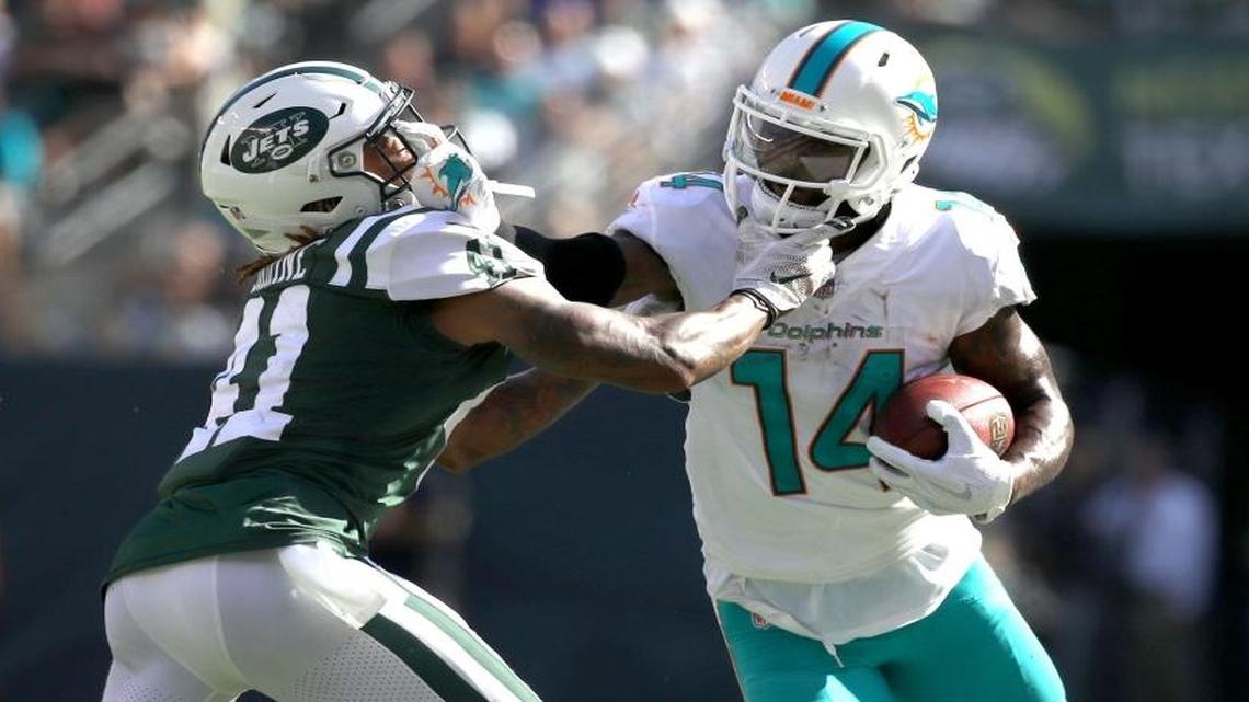 Miami Dolphins wide receiver Jarvis Landry (14) battles with New York Jets cornerback Buster Skrine (41) for yardage in the third quarter as the New York Jets host the Miami Dolphins at Met Life Stadium on Sunday, September 24, 2017.