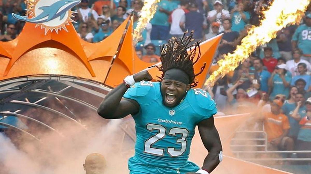 Miami Dolphins running back Jay Ajayi (23) rushes onto the field as the Miami Dolphins host the New England Patriots at Hard Rock Stadium on Sunday, January 1, 2017.