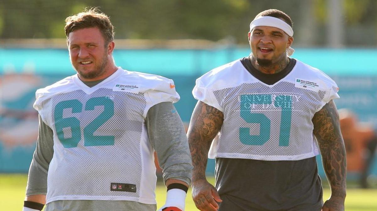 Miami Dolphins lineman Ted Larsen 62 and Mike Pouncey 51, during training camp at the Miami Dolphins training facility in Davie, Fl, July 28, 2017.
