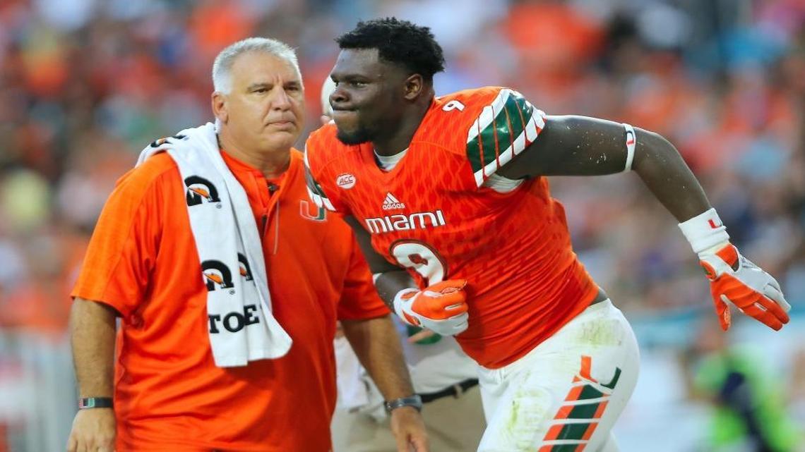 University of Miami Hurricanes defensive linemen Chad Thomas walks off the field after being injured in a play in the second quarter of an NCAA college football game against FAU Owls, Sat. Sept. 10, 2016, in Miami Gardens.