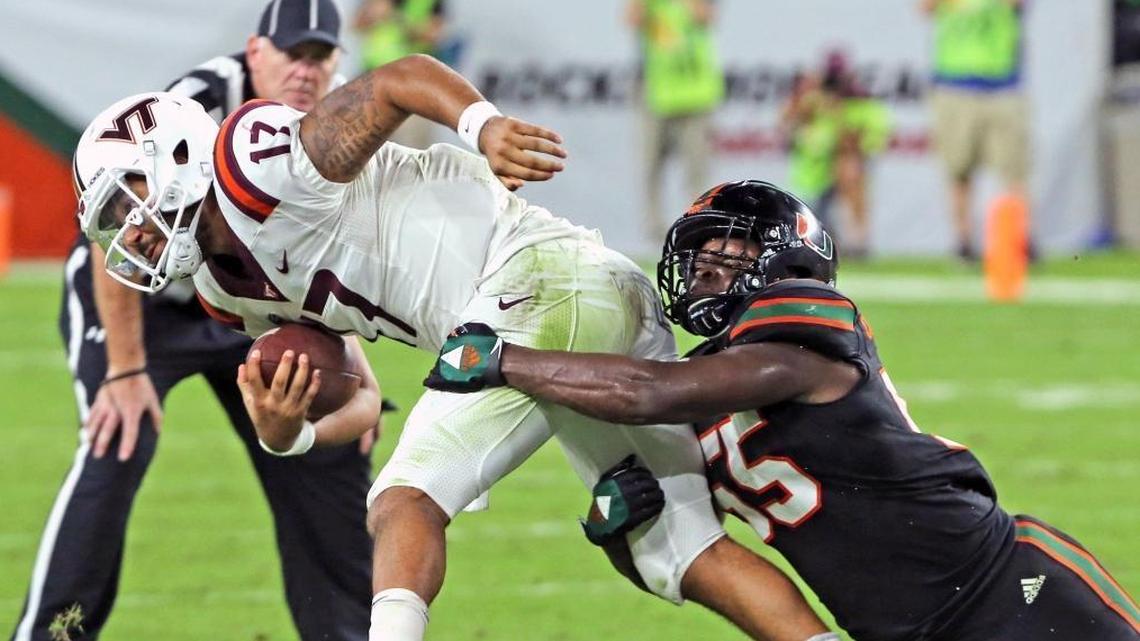 Miami Hurricanes linebacker Shaquille Quarterman (55) tackles Virginia Tech quarterback Josh Jackson (17) in a game last November. Quarterman is expected to be one of UM’s top players this season.