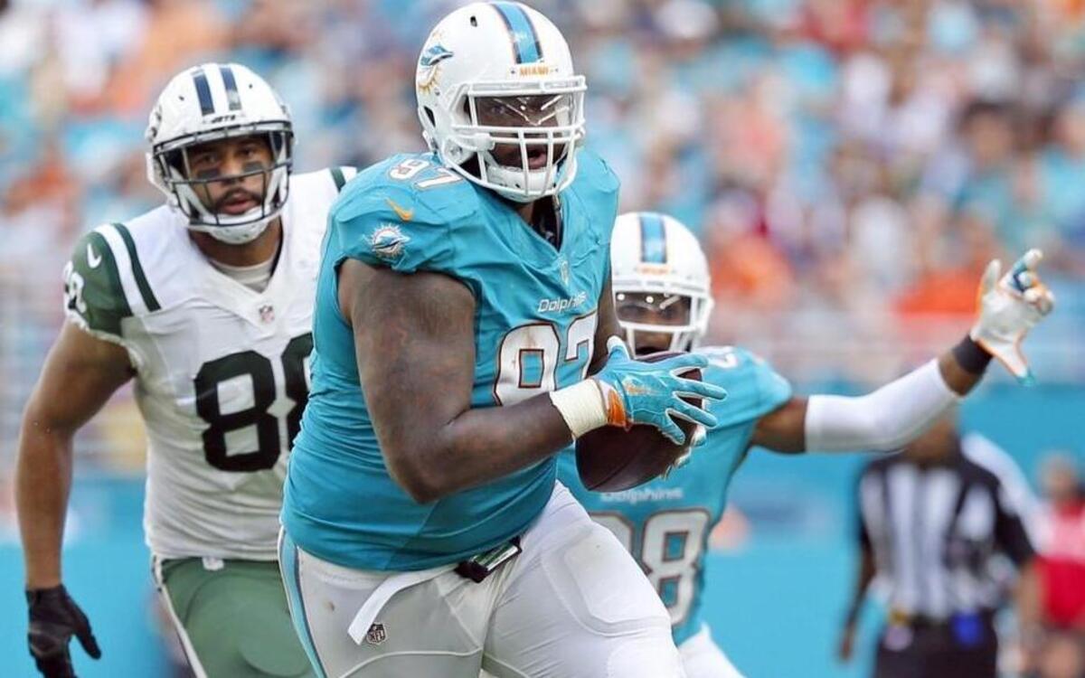 Miami Dolphins defensive tackle Jordan Phillips (97) intercepts the ball in the third quarter as the Miami Dolphins host the New York Jets at Hard Rock Stadium on Sun., Nov. 6, 2016.