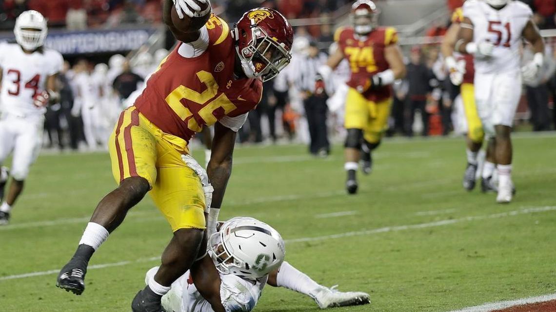 Southern California running back Ronald Jones II (25) scores a touchdown against Stanford safety Justin Reid during the second half of the Pac-12 Conference championship football game on Dec. 1, 2017. Reid visits the Dolphins Wednesday.