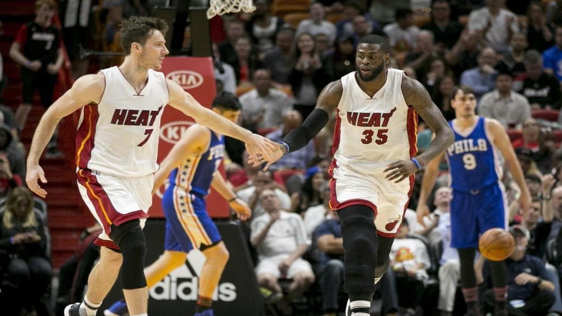 Miami Heat guard Goran Dragic (7) and forward Willie Reed (35) celebrate after Reed scores in the second half as the Miami Heat host the Philadelphia 76ers at the American Airlines Arena on Sat., Feb. 4, 2017.