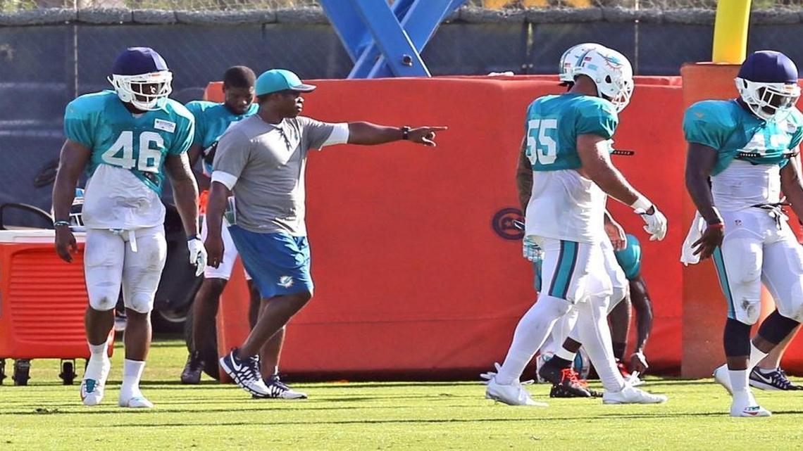 Defensive coordinator Vance Joseph works with the defense at the Miami Dolphins training facility in Davie, Florida, Aug. 5, 2016.