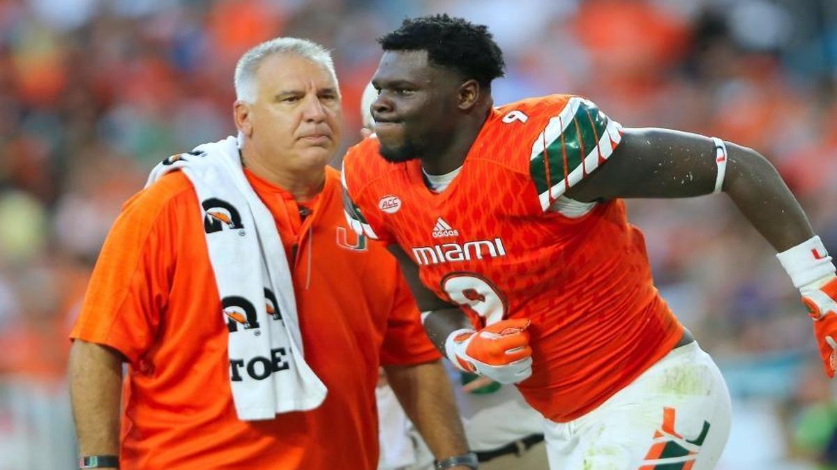 University of Miami Hurricanes defensive linemen Chad Thomas walks off the field after being injured in a play in the second quarter of an NCAA college football game against FAU Owls, Sat., Sept. 10, 2016, in Miami Gardens.