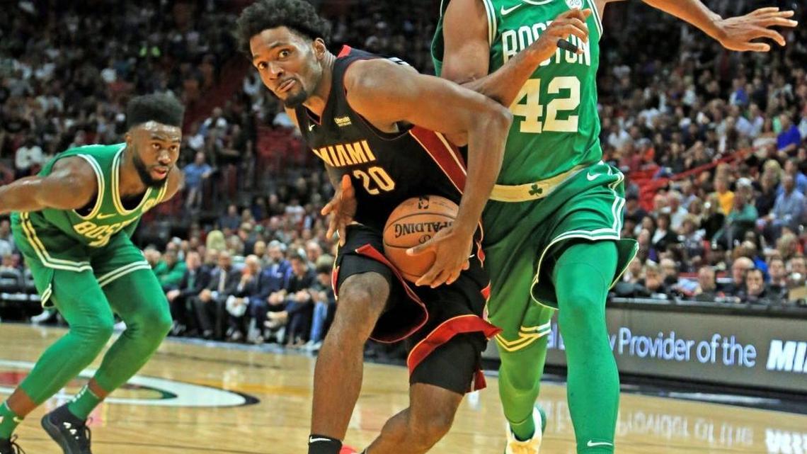 Miami Heat forward Justise Winslow (20) gets inside as Boston Celtics center Al Horford (42) defends in the second half as the Miami Heat host the Boston Celtics at AmericanAirlines Arena on Saturday, October 28, 2017.