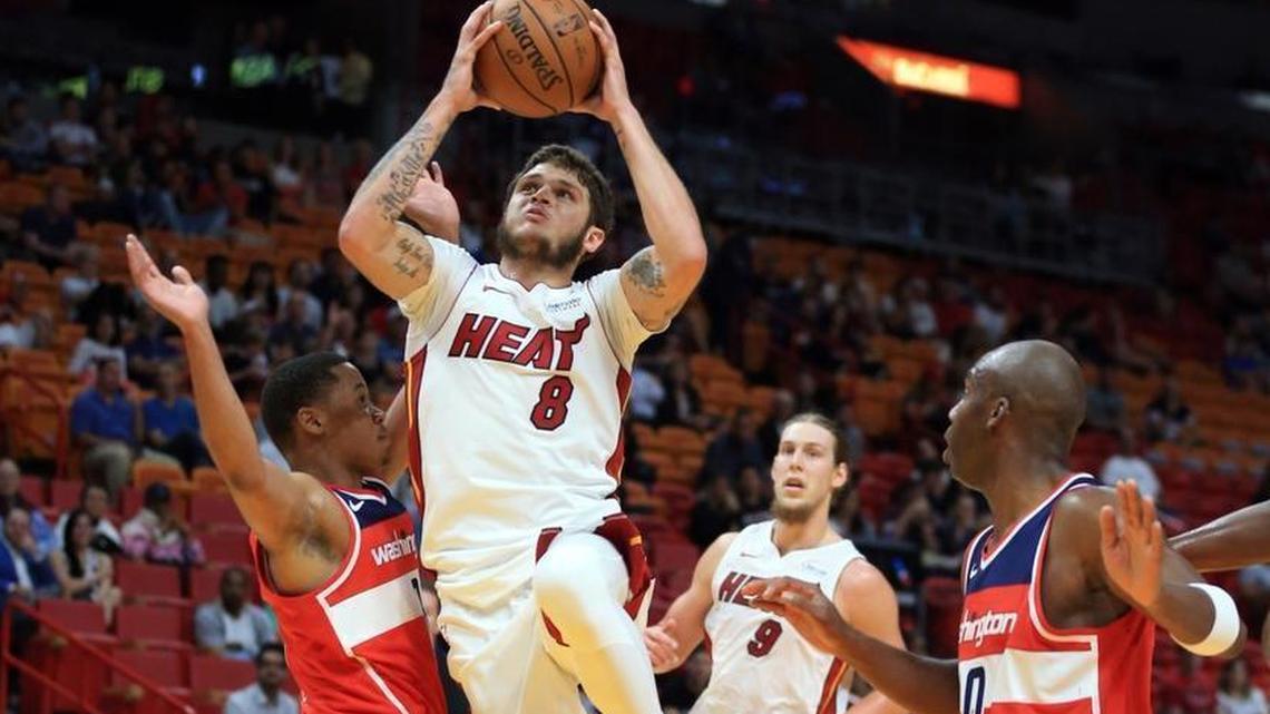 Miami Heat guard Tyler Johnson (8) drives to the basket to score in the first quarter as the Miami Heat host the Washington Wizards at the AmericanAirlines Arena on Wednesday, October 11, 2017.
