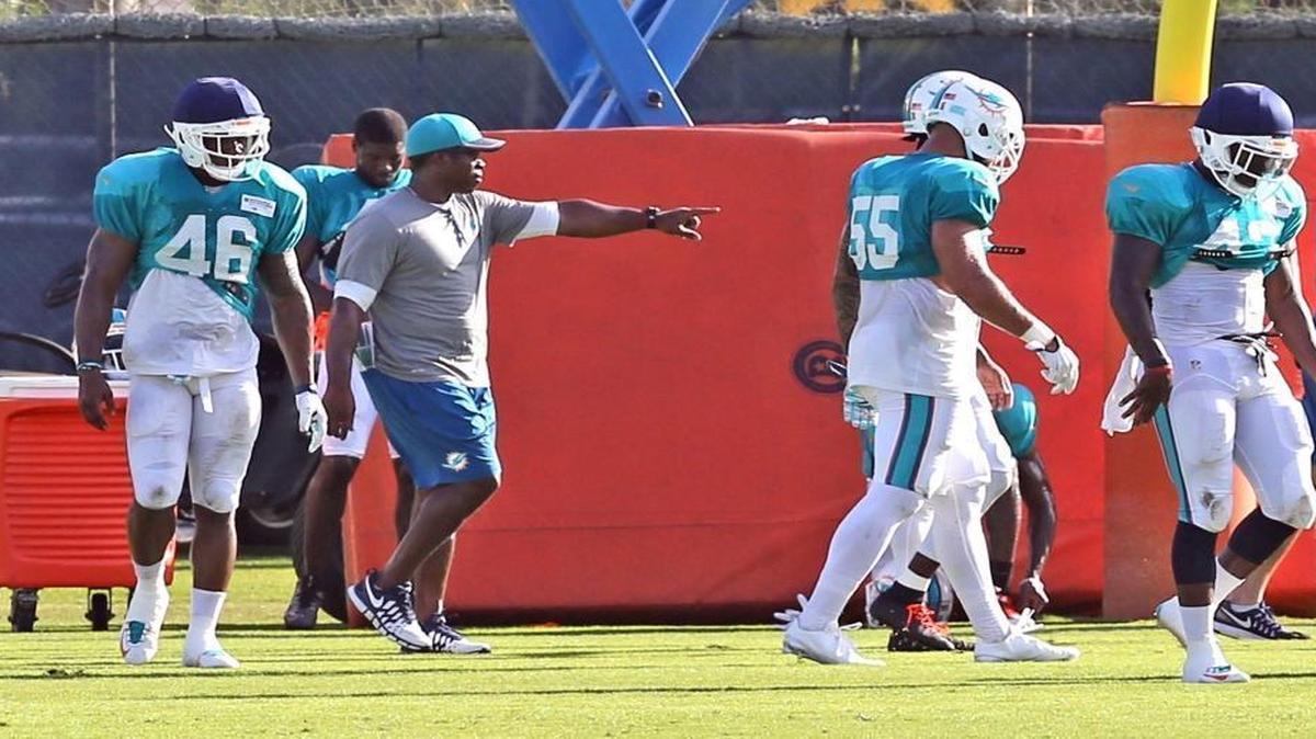 Defensive coordinator Vance Joseph works with the defense at the Miami Dolphins training facility in Davie, Florida, Aug. 5, 2016.