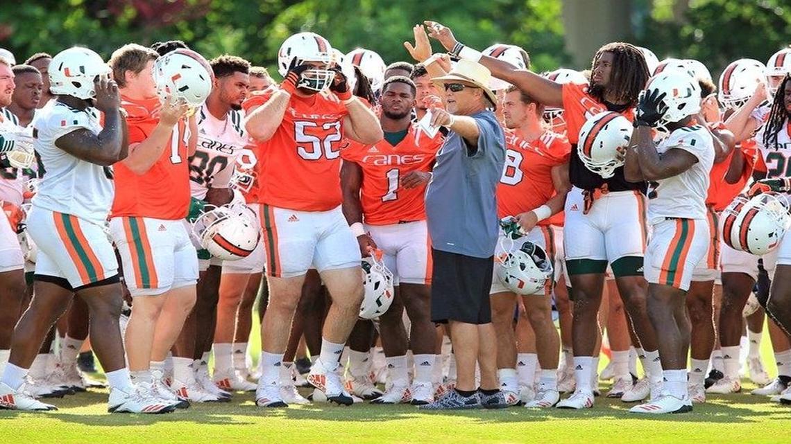 Head coach Mark Richt (12) talks with players during football practice at the University of Miami on Wednesday, Aug. 23, 2017.