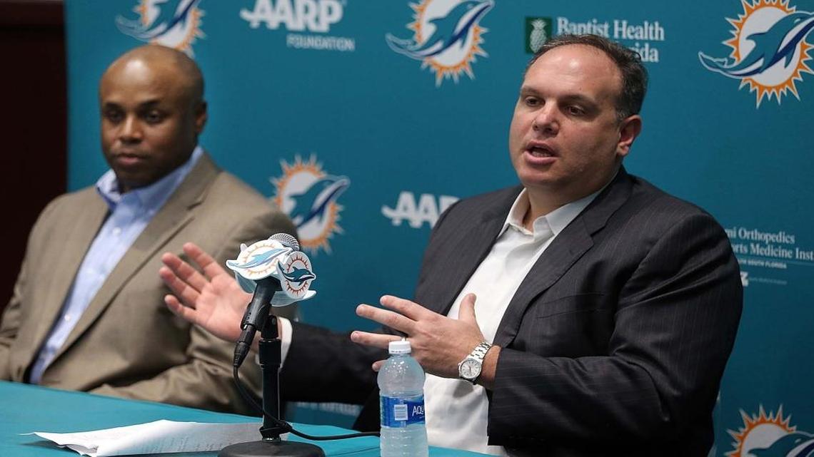 from left- Chris Grier, Miami Dolphins General Manager and Mike Tannenbaum, Executive Vice President, Football Operations, talk during a pre-draft press conference at Doctors Hospital Training Facility at Nova Southeastern University on Fri., April 22, 2016.