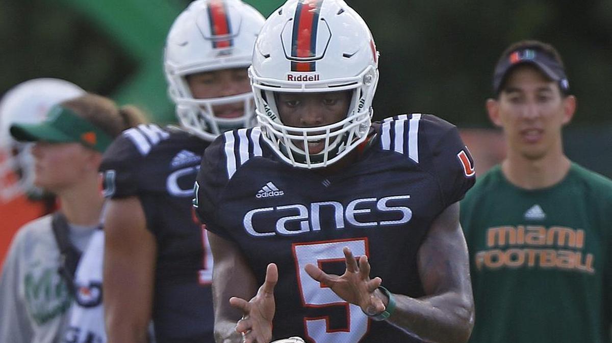 Hurricanes quarterback N'Kosi Perry performs drills during an August practice. The highly-toued freshman is redshirting this season.